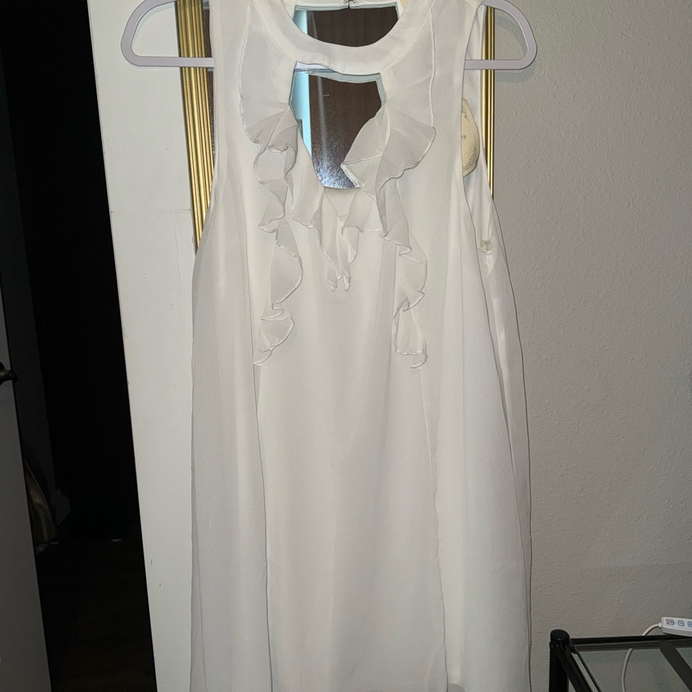 Elegant White Ruffle Sleeveless Top
